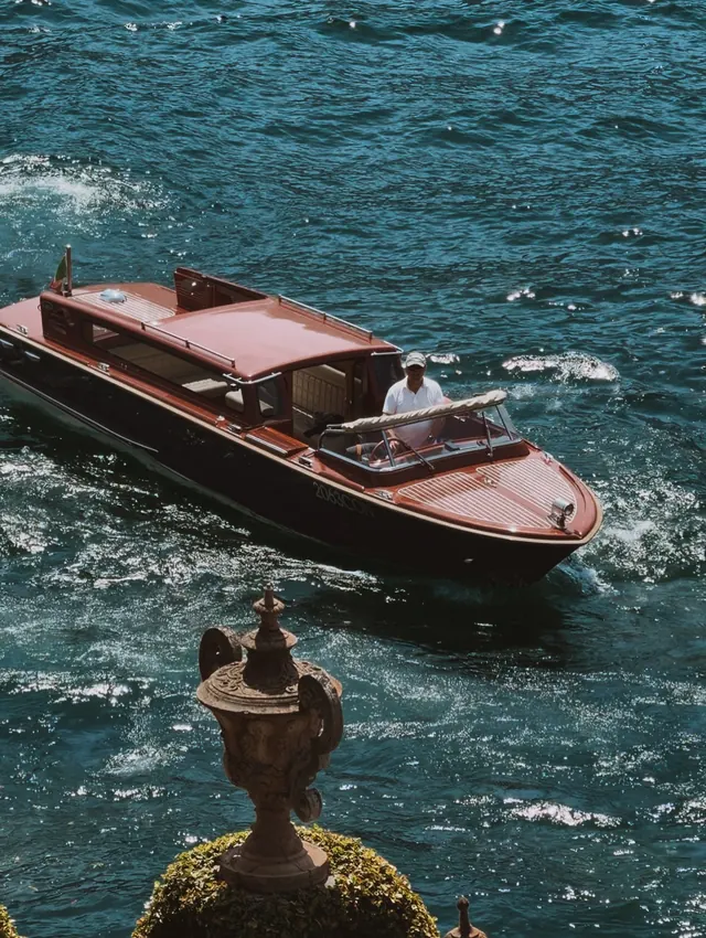 A classic wooden Riva boat on the water