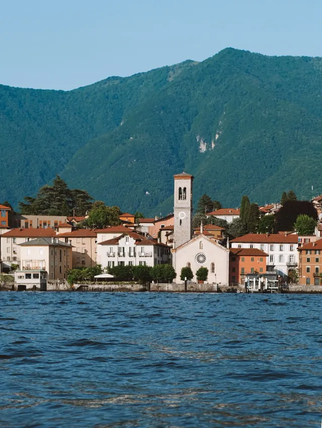 A lakeside village in warm evening light
